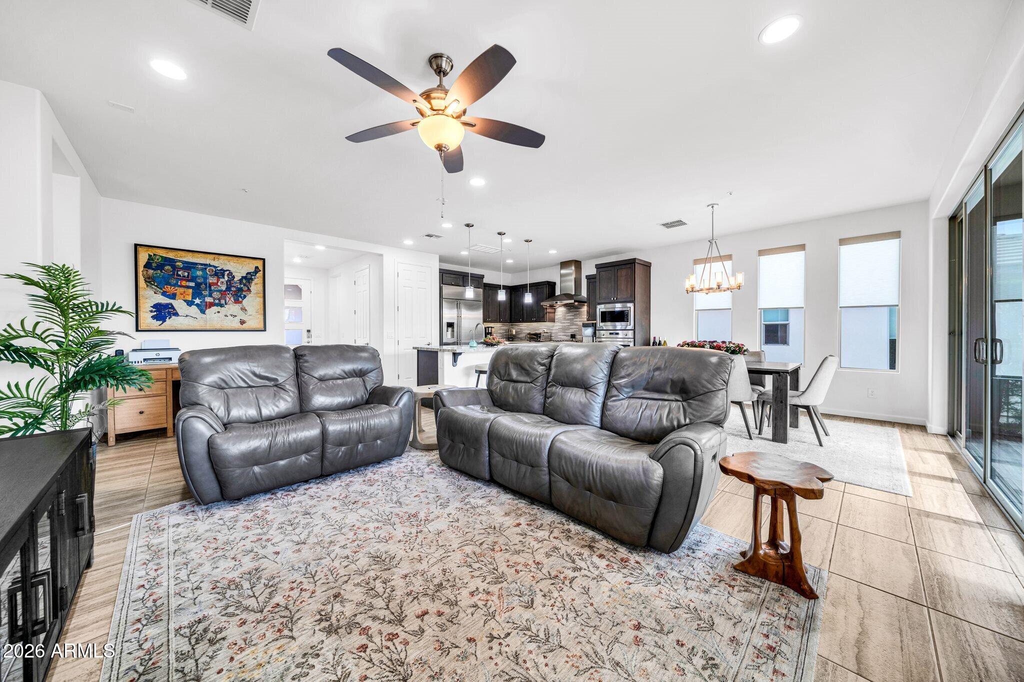 17983 East Vista Desierto Rio Verde, AZ 85263 - Photo 15 of 30 a living room with furniture kitchen view and a chandelier