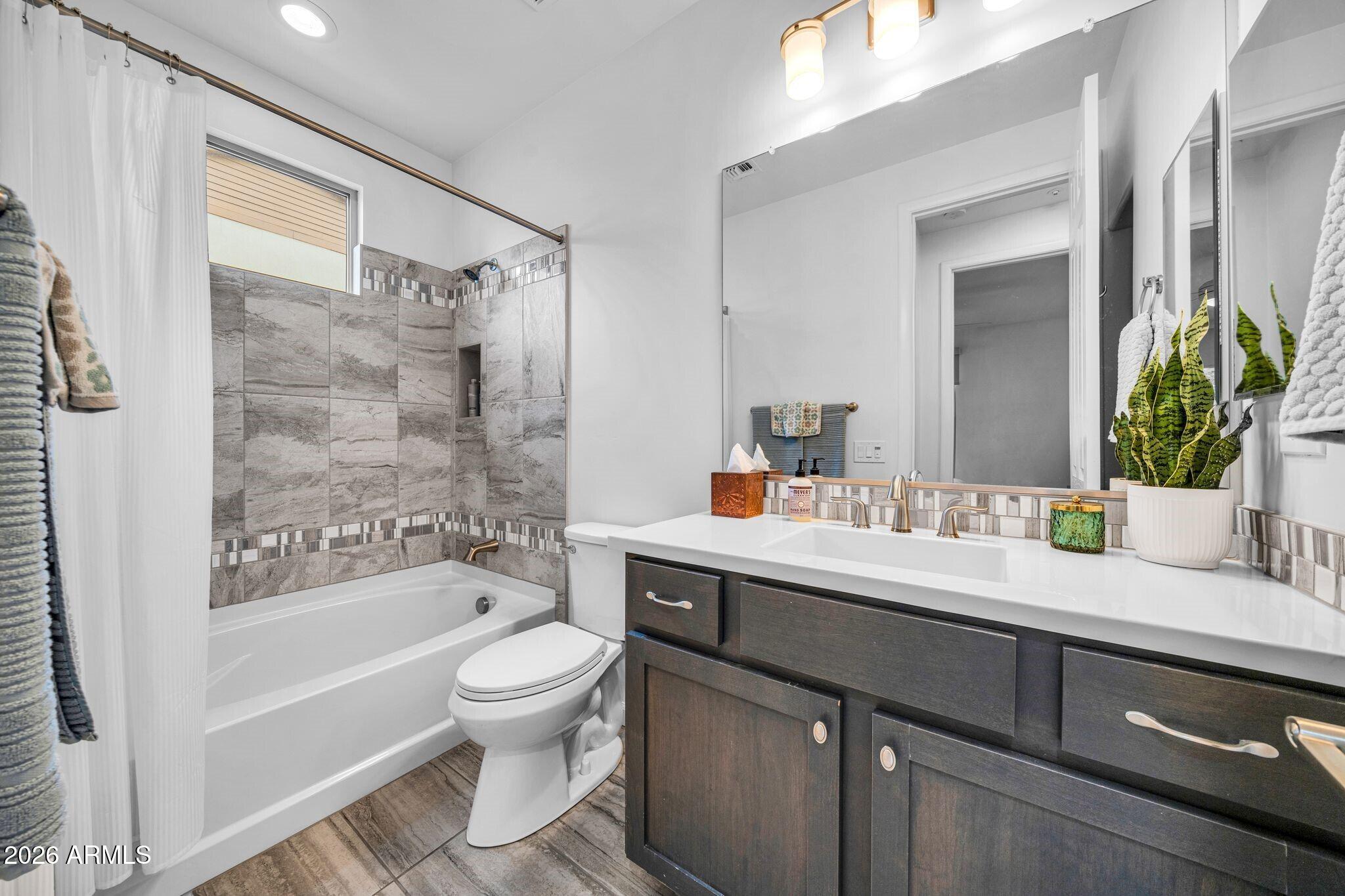 17983 East Vista Desierto Rio Verde, AZ 85263 - Photo 22 of 30 a bathroom with a sink a toilet and a bathtub