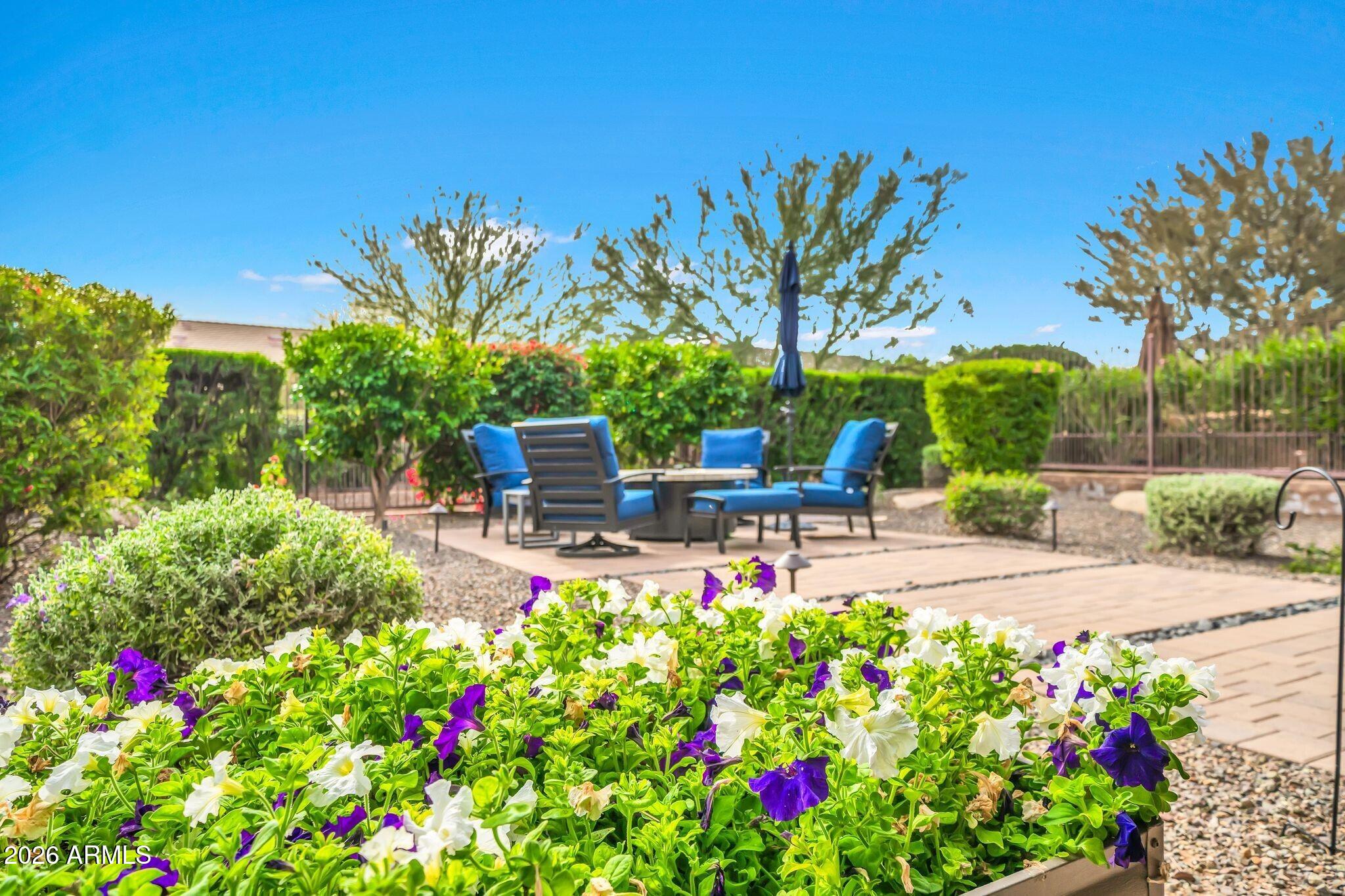 17983 East Vista Desierto Rio Verde, AZ 85263 - Photo 27 of 30 a view of a chair and tables in the garden