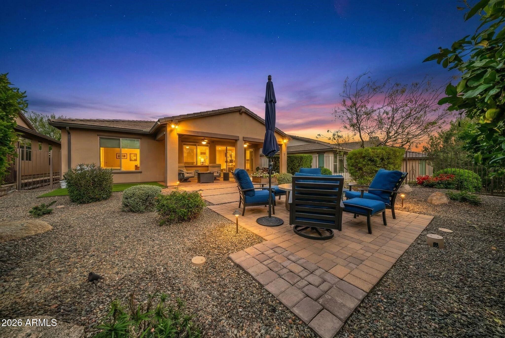 17983 East Vista Desierto Rio Verde, AZ 85263 - Photo 4 of 30 a view of a patio with a table and chairs under an umbrella