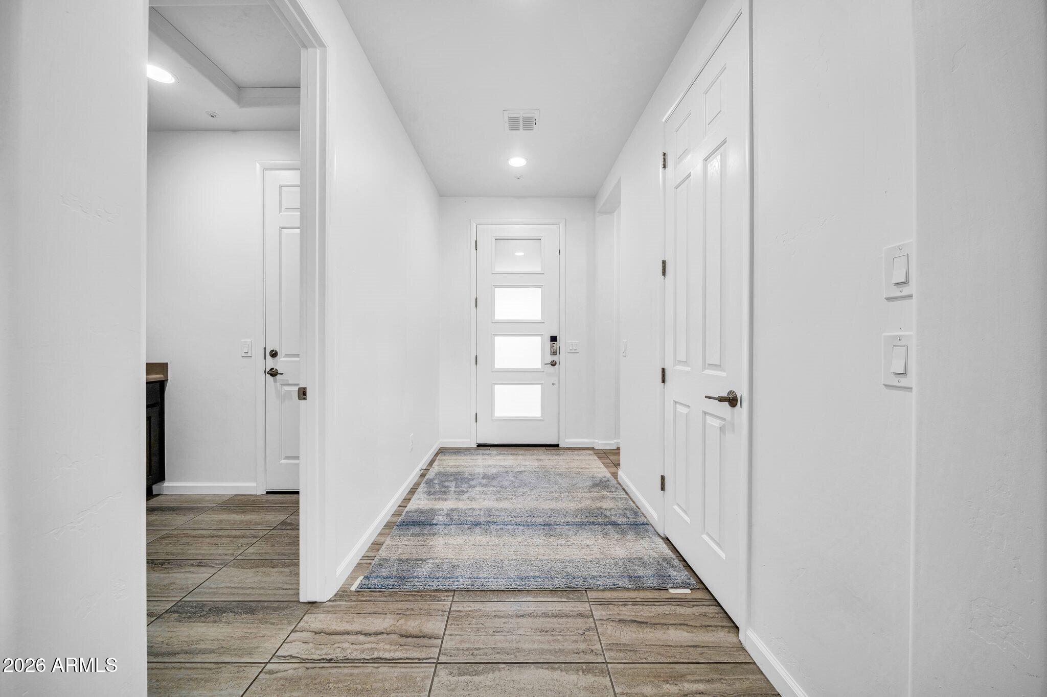 17983 East Vista Desierto Rio Verde, AZ 85263 - Photo 6 of 30 a view of a hallway with wooden floor and closet area