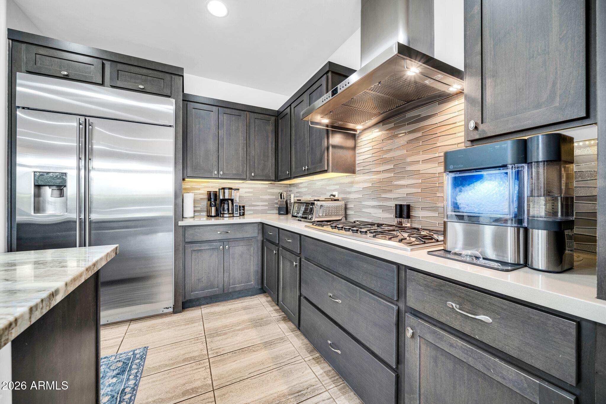 17983 East Vista Desierto Rio Verde, AZ 85263 - Photo 10 of 30 a kitchen with granite countertop a sink stainless steel appliances and cabinets