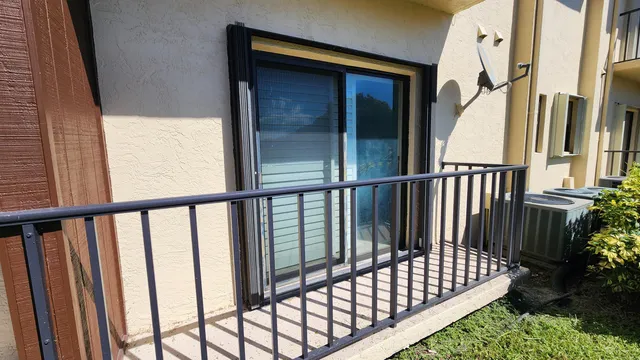 a view of a balcony with wooden floor