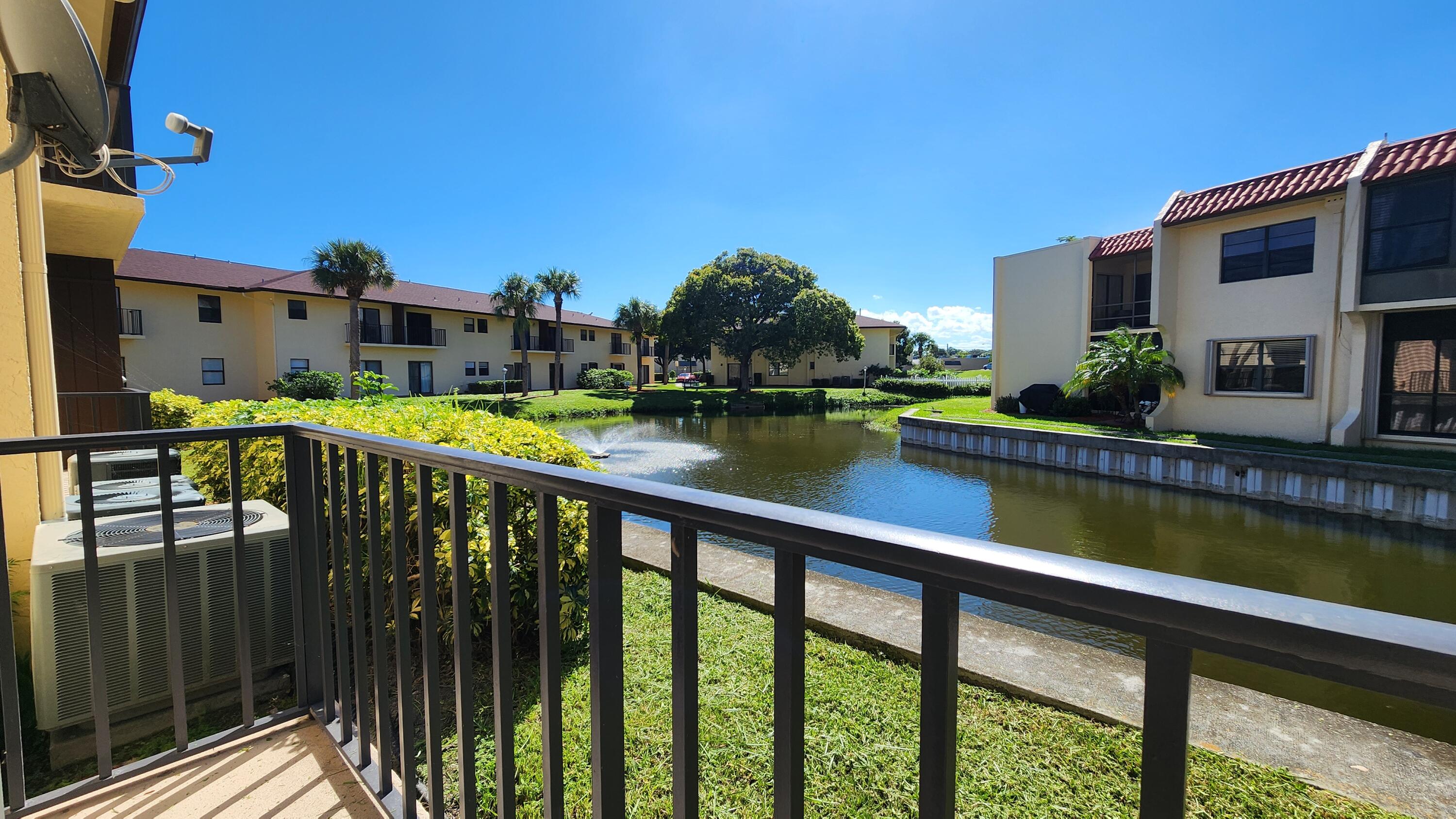 2050 Oleander Boulevard, Unit 9104 Fort Pierce, FL 34950 - Photo 21 of 27 a view of swimming pool with outdoor seating and city view