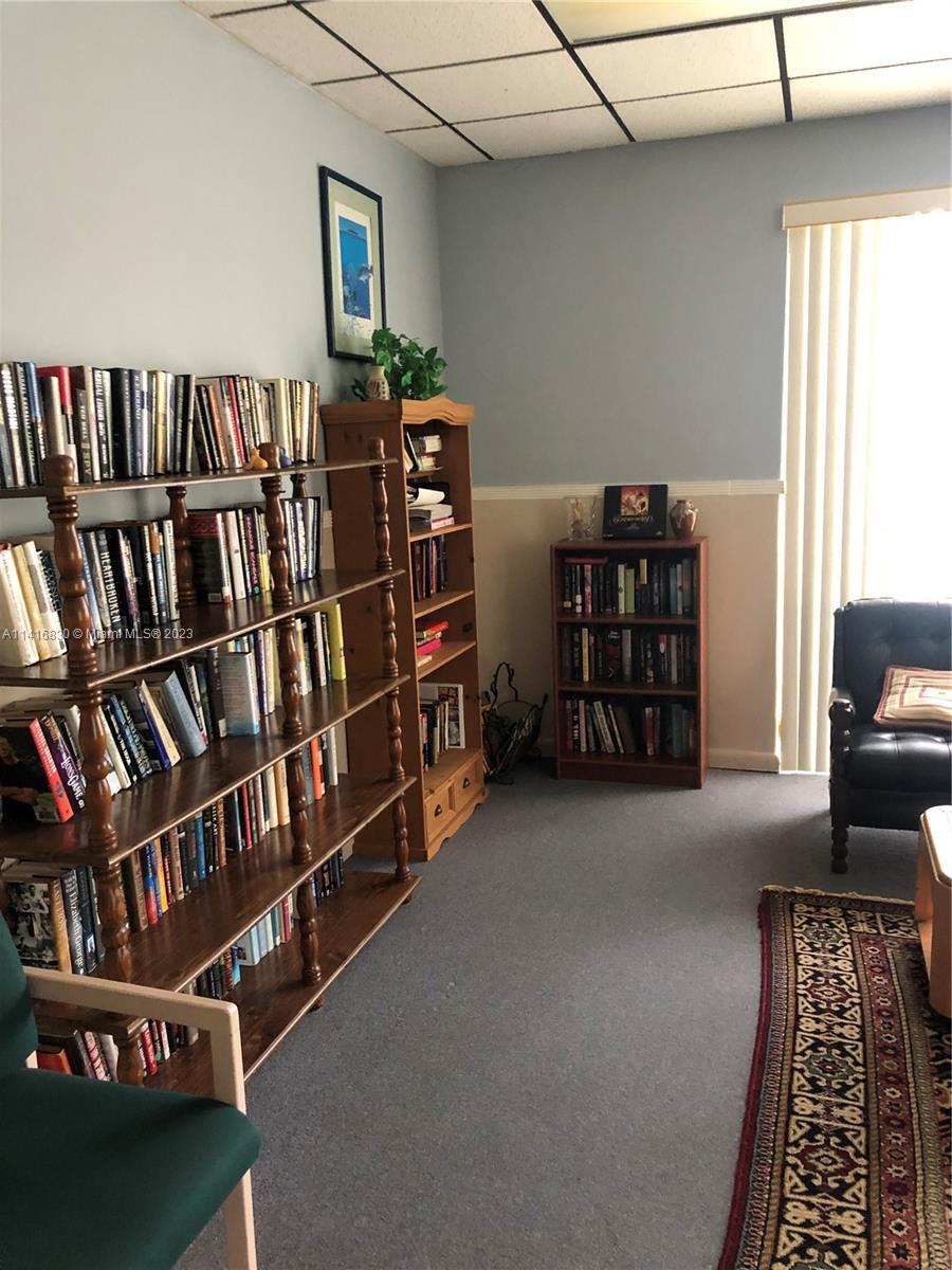 2050 Oleander Boulevard, Unit 9104 Fort Pierce, FL 34950 - Photo 27 of 27 a view of a livingroom with furniture and book shelf