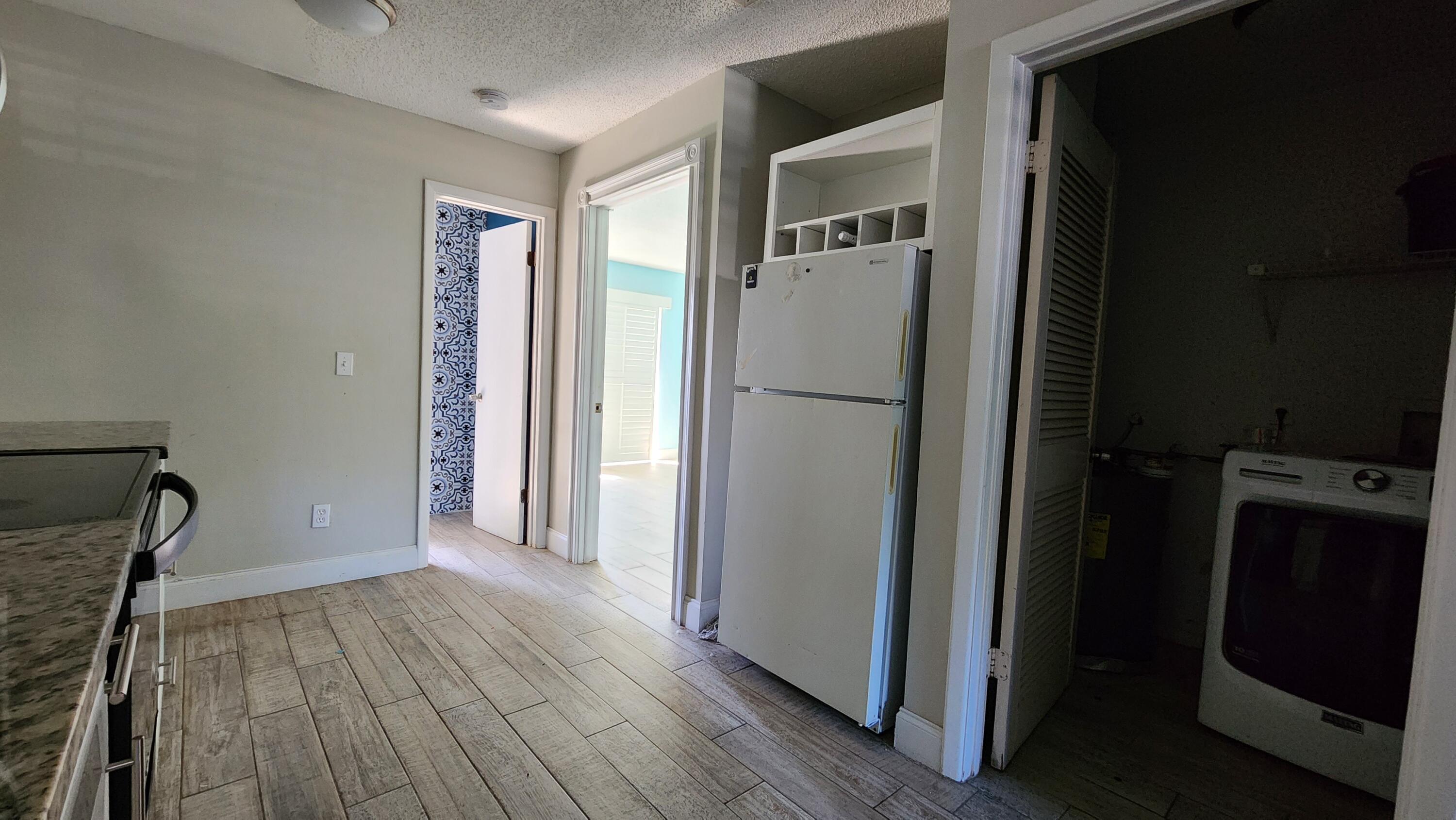 2050 Oleander Boulevard, Unit 9104 Fort Pierce, FL 34950 - Photo 10 of 27 a view of empty room with wooden floor