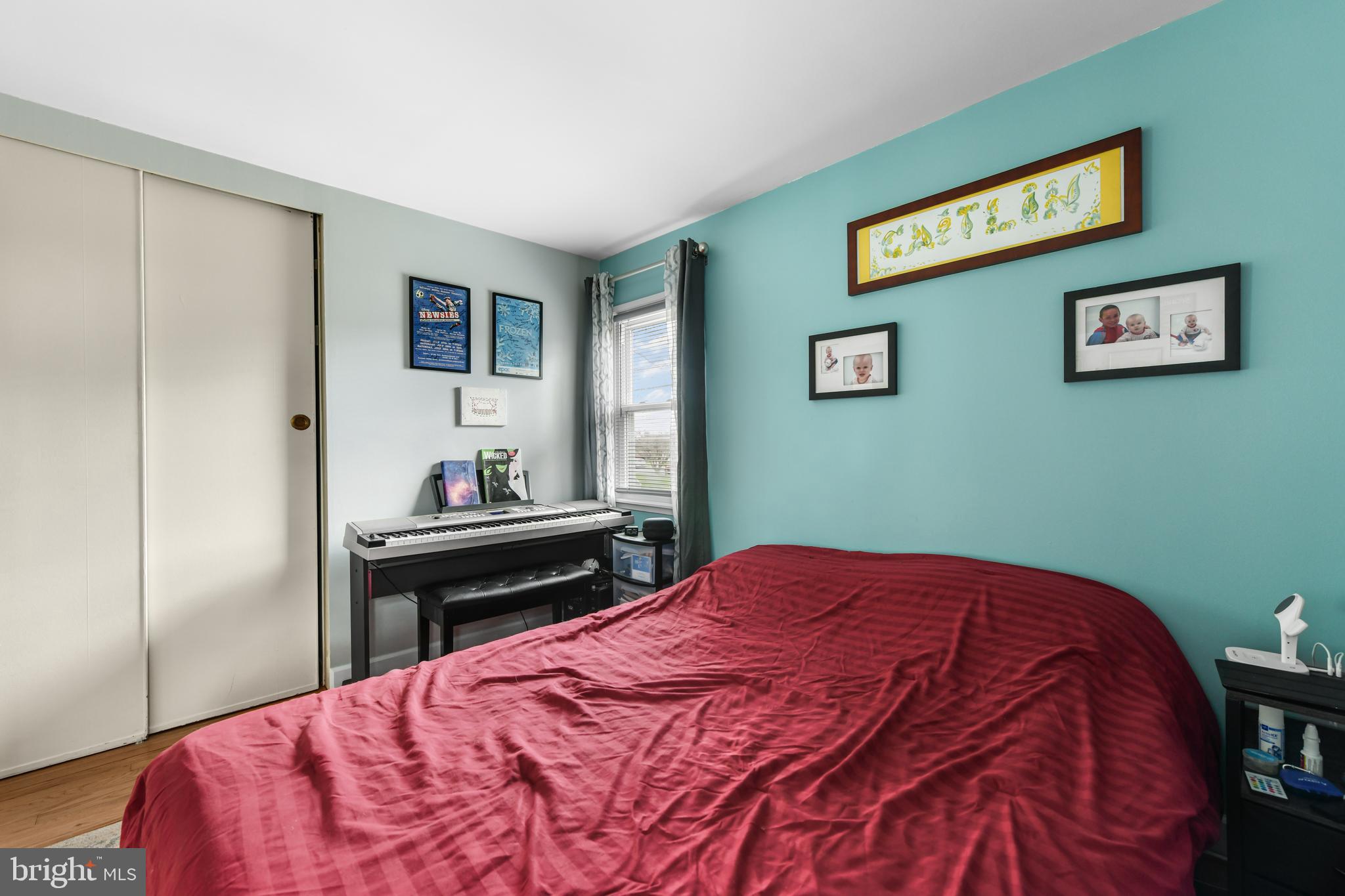 203 Eric Avenue Reading, PA 19607 - Photo 16 of 46 a bedroom with a bed and wooden floor