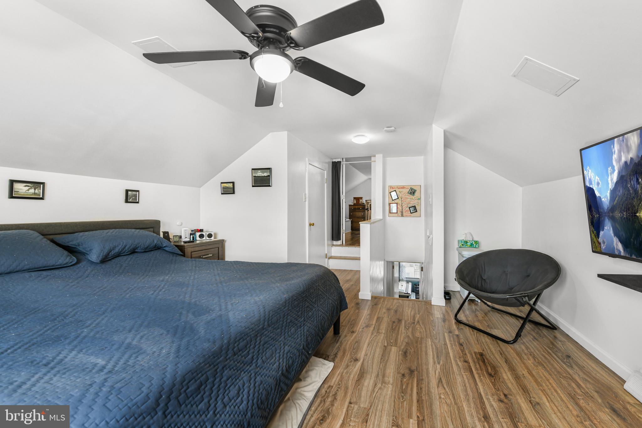 203 Eric Avenue Reading, PA 19607 - Photo 18 of 46 a bedroom with a bed and wooden floor