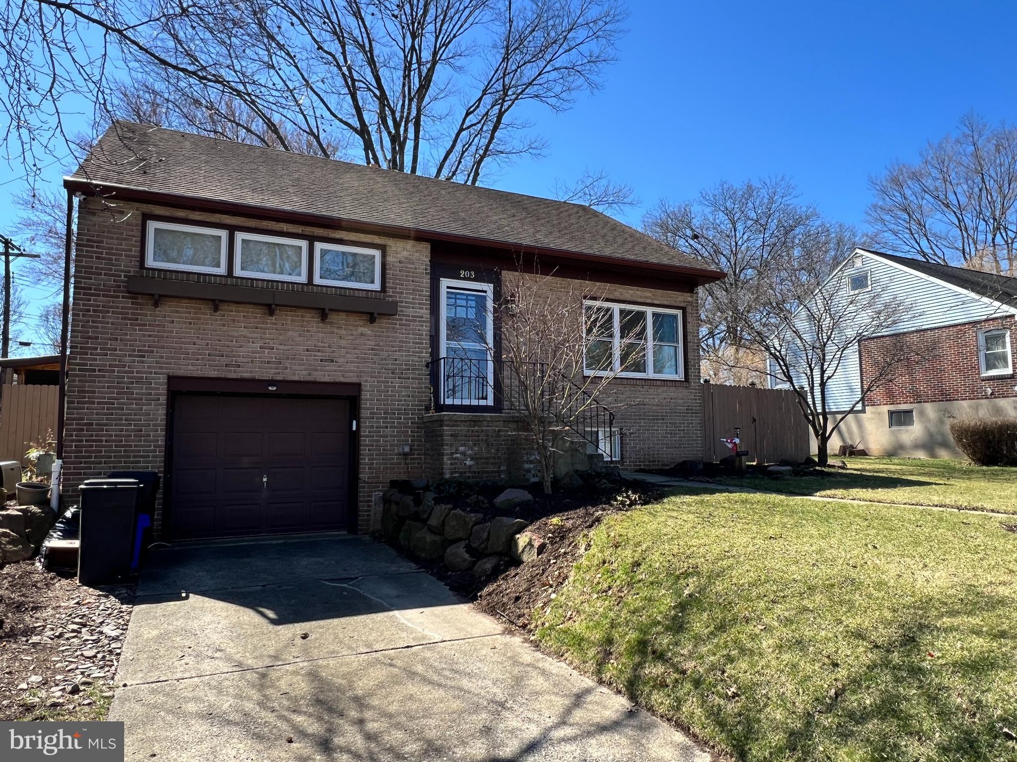 203 Eric Avenue Reading, PA 19607 - Photo 41 of 46 a front view of a house with a yard