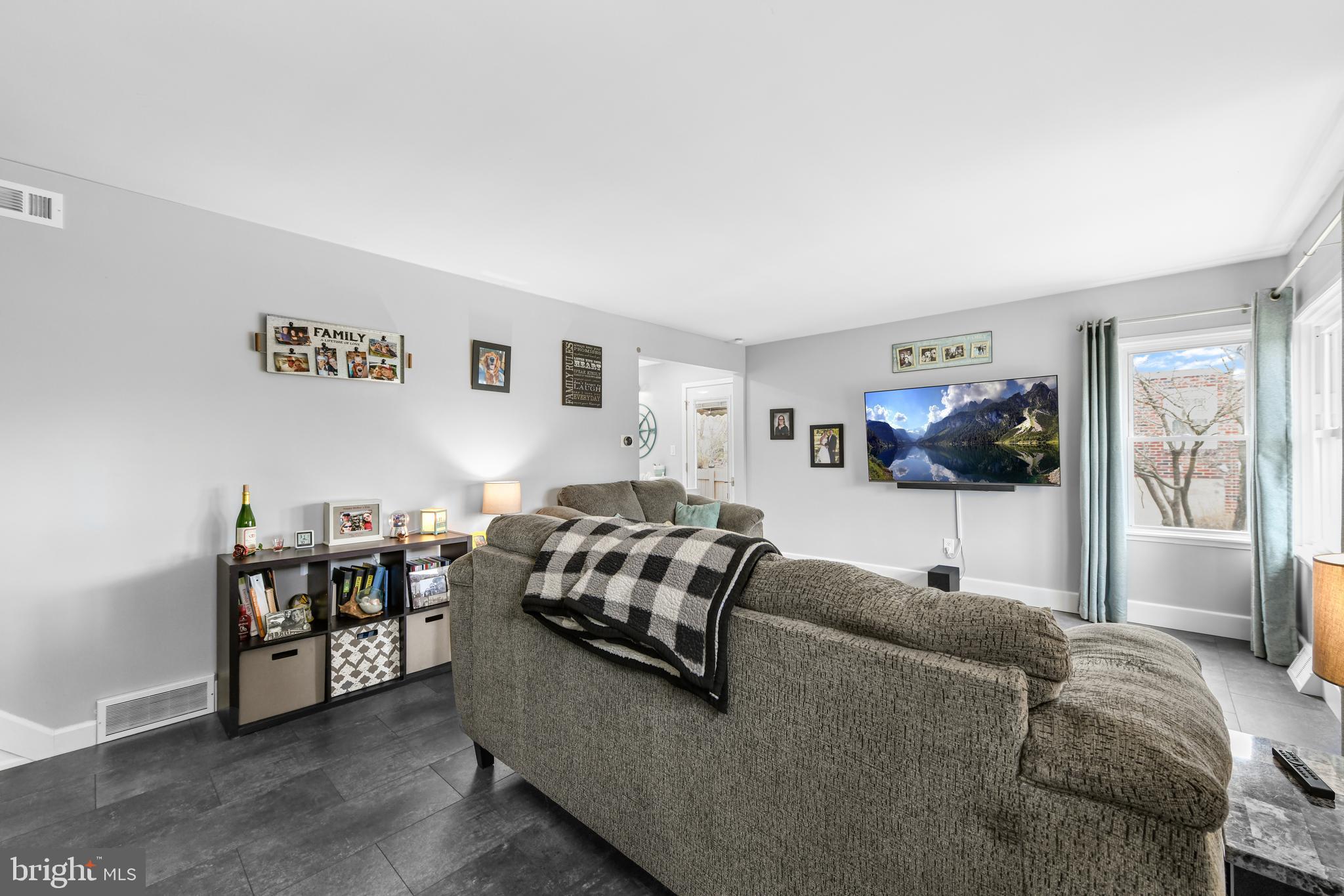 203 Eric Avenue Reading, PA 19607 - Photo 8 of 46 a living room with furniture and a flat screen tv