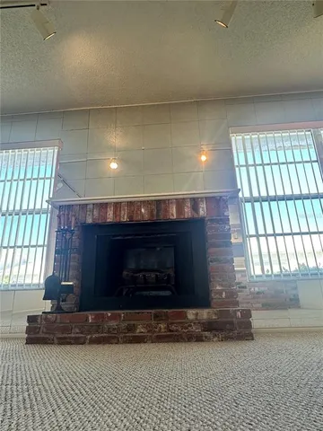 a kitchen with a sink and a stove top oven