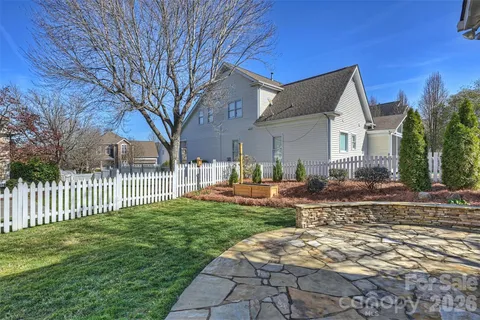 a house view with a sitting space and garden