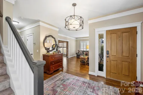 a view of living room and wooden floor