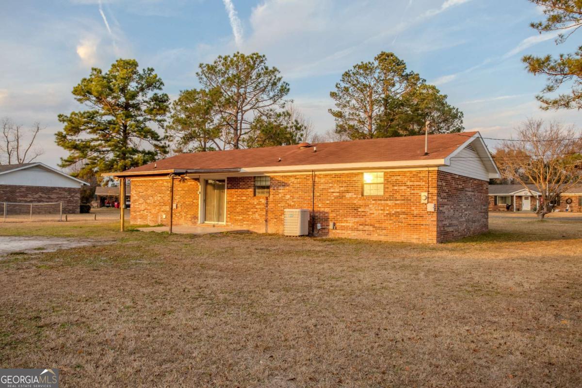 121 Trapper Trail Blackshear, GA 31516 - Photo 4 of 21 a view of a house with a outdoor space