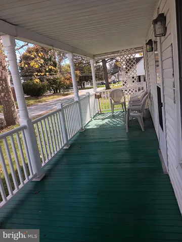 a view of a porch and garden