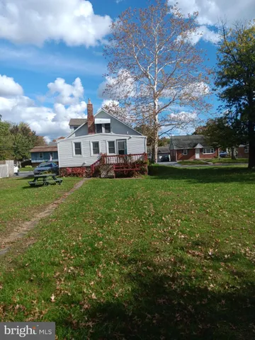a view of a house with a big yard