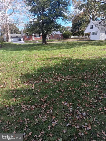 a view of a house with a big yard