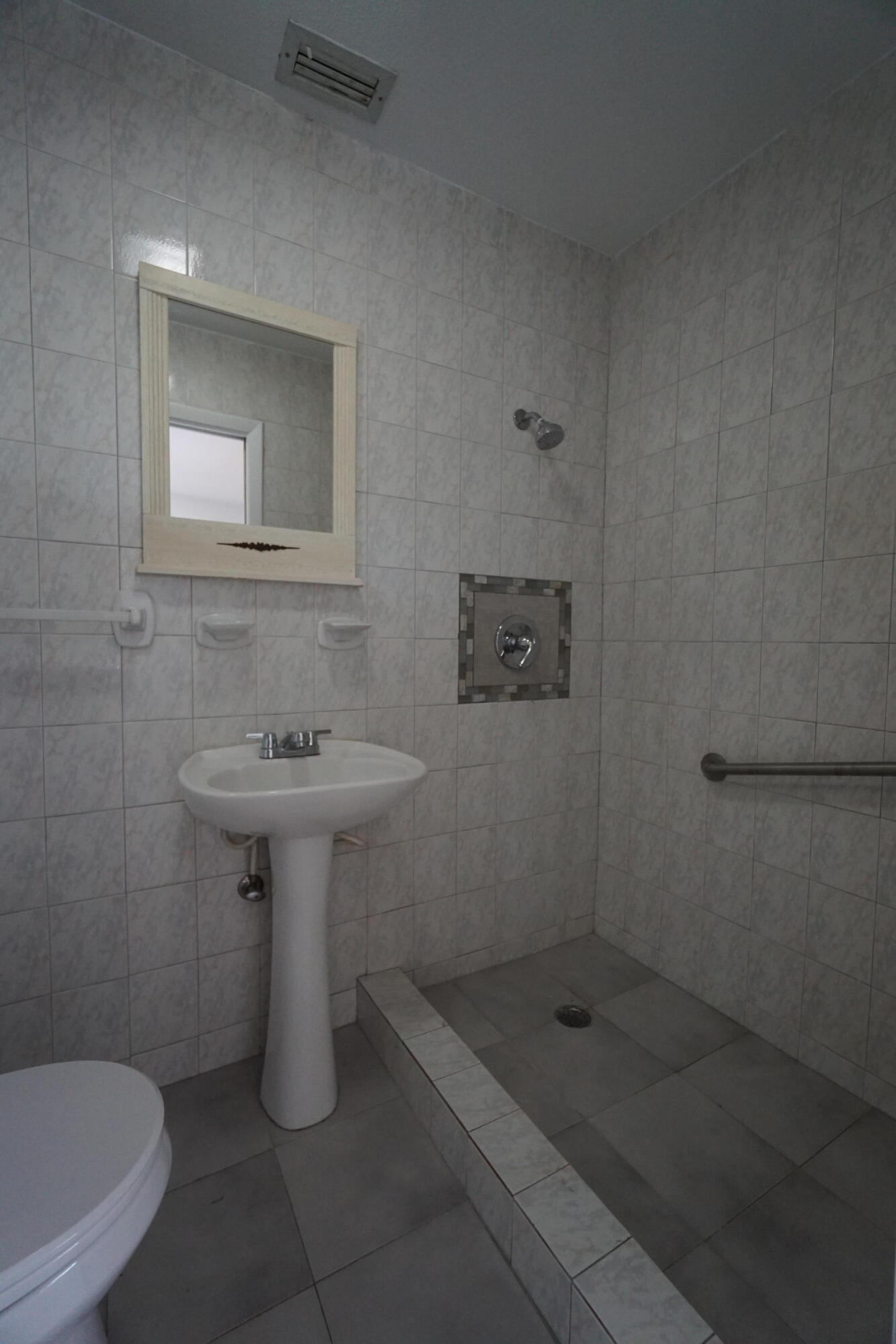 15520 Southwest 302nd Street Homestead, FL 33033 - Photo 11 of 20 a bathroom with a sink a toilet and shower