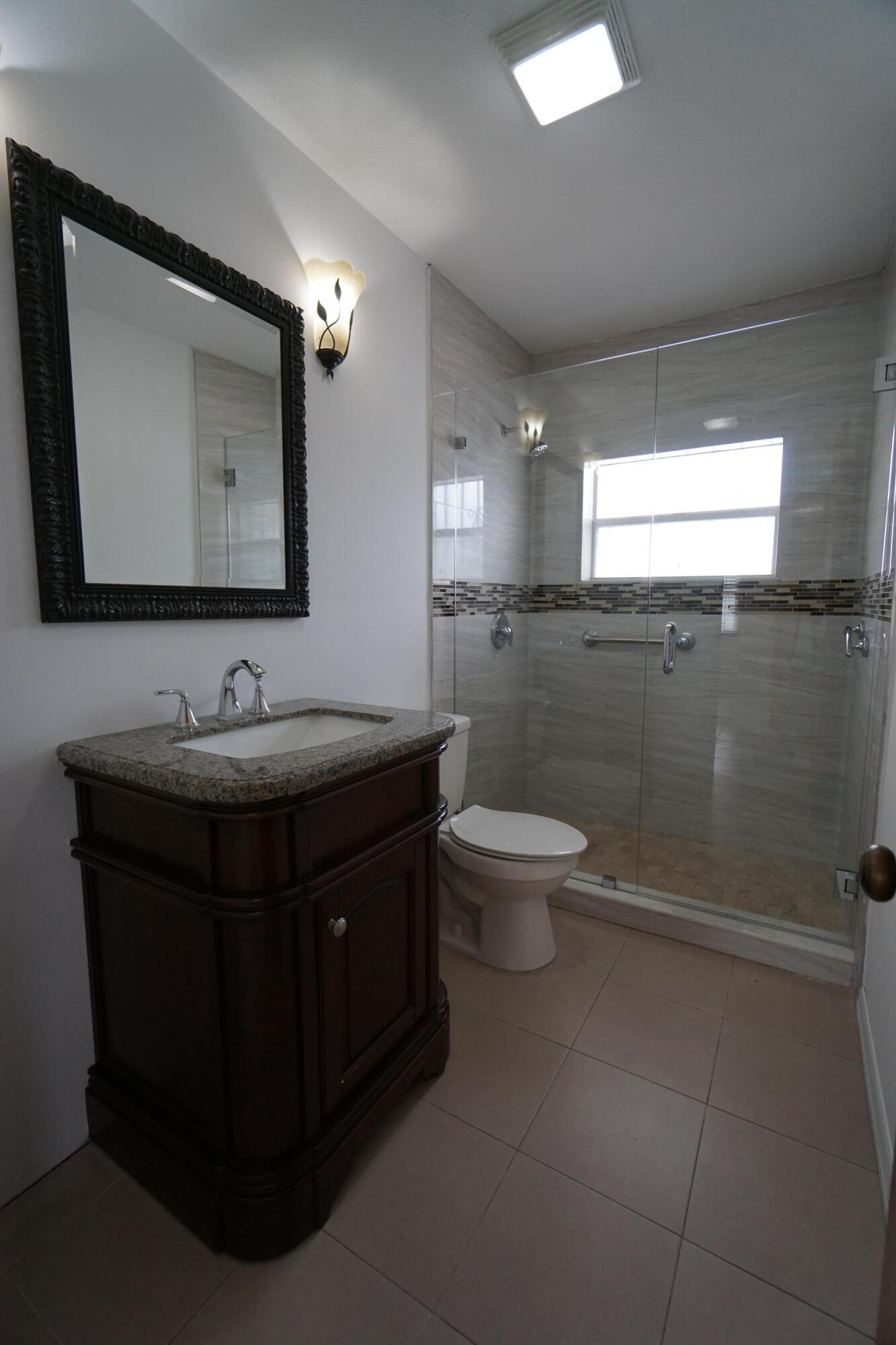 15520 Southwest 302nd Street Homestead, FL 33033 - Photo 12 of 20 a bathroom with a sink and a mirror