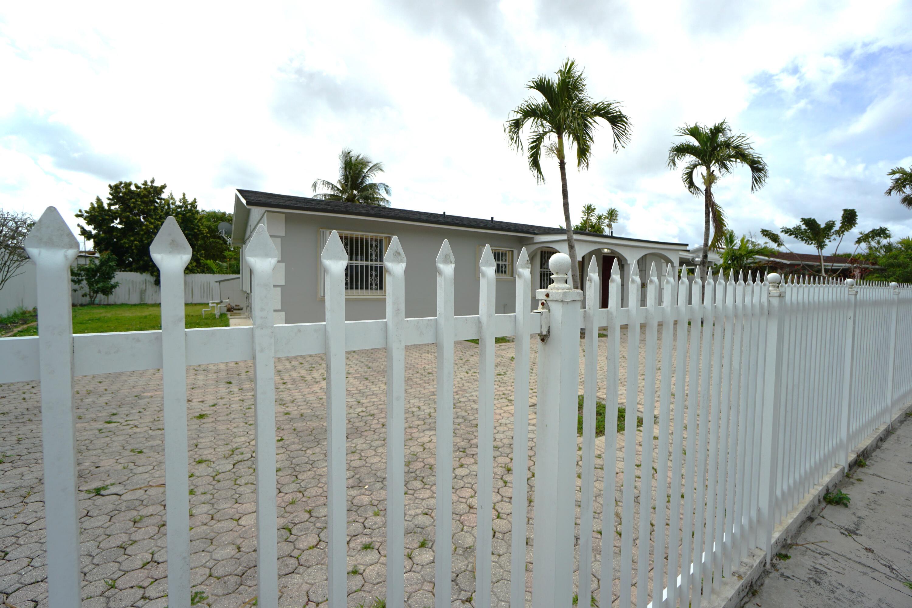 15520 Southwest 302nd Street Homestead, FL 33033 - Photo 13 of 20 a view of front door