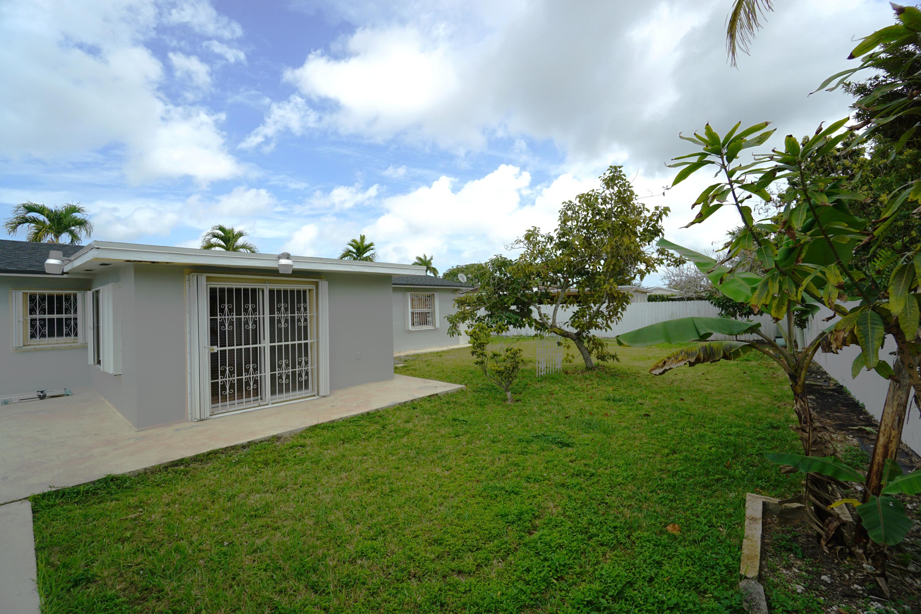 15520 Southwest 302nd Street Homestead, FL 33033 - Photo 2 of 20 a view of a house with a backyard