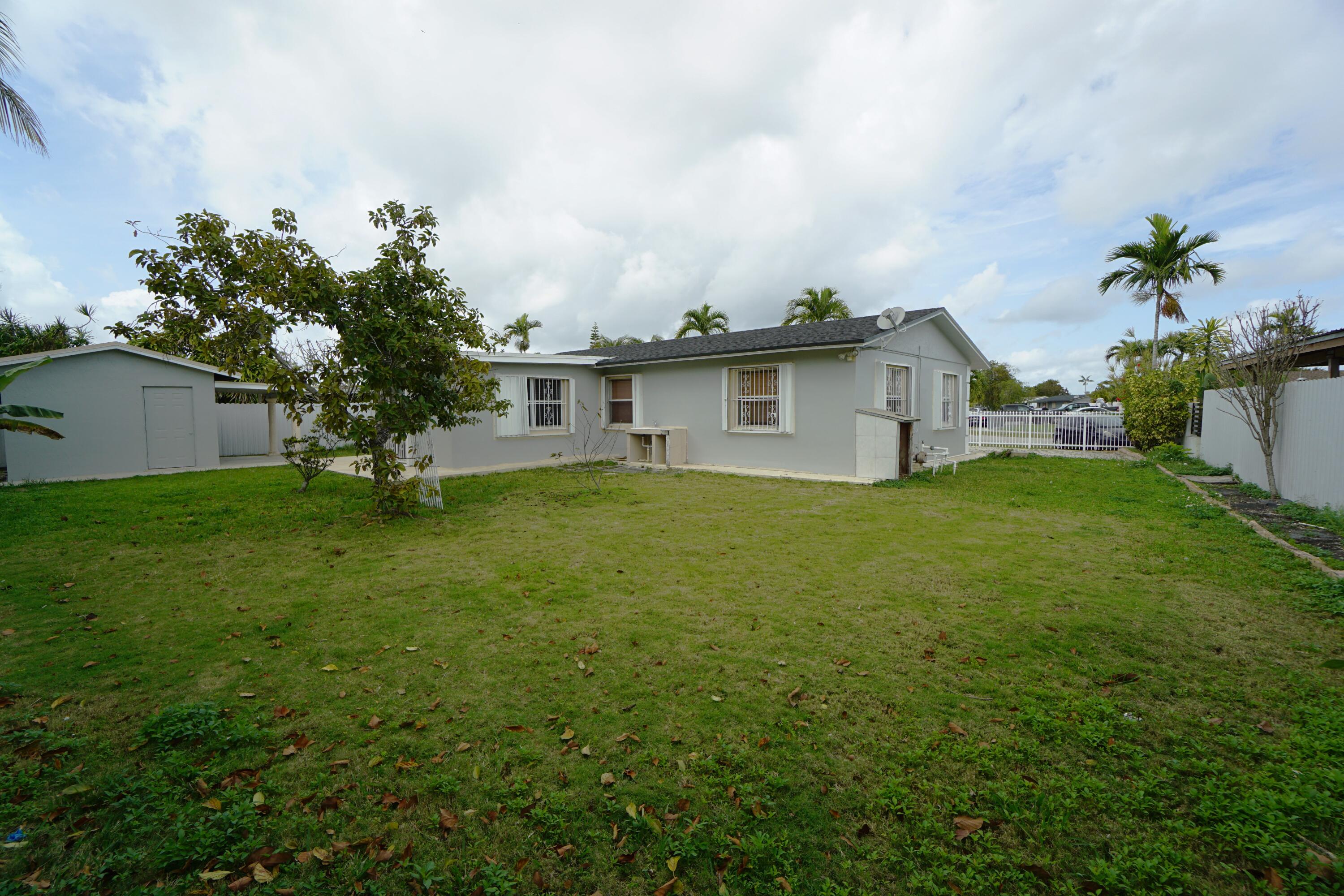 15520 Southwest 302nd Street Homestead, FL 33033 - Photo 3 of 20 a view of a house with a yard