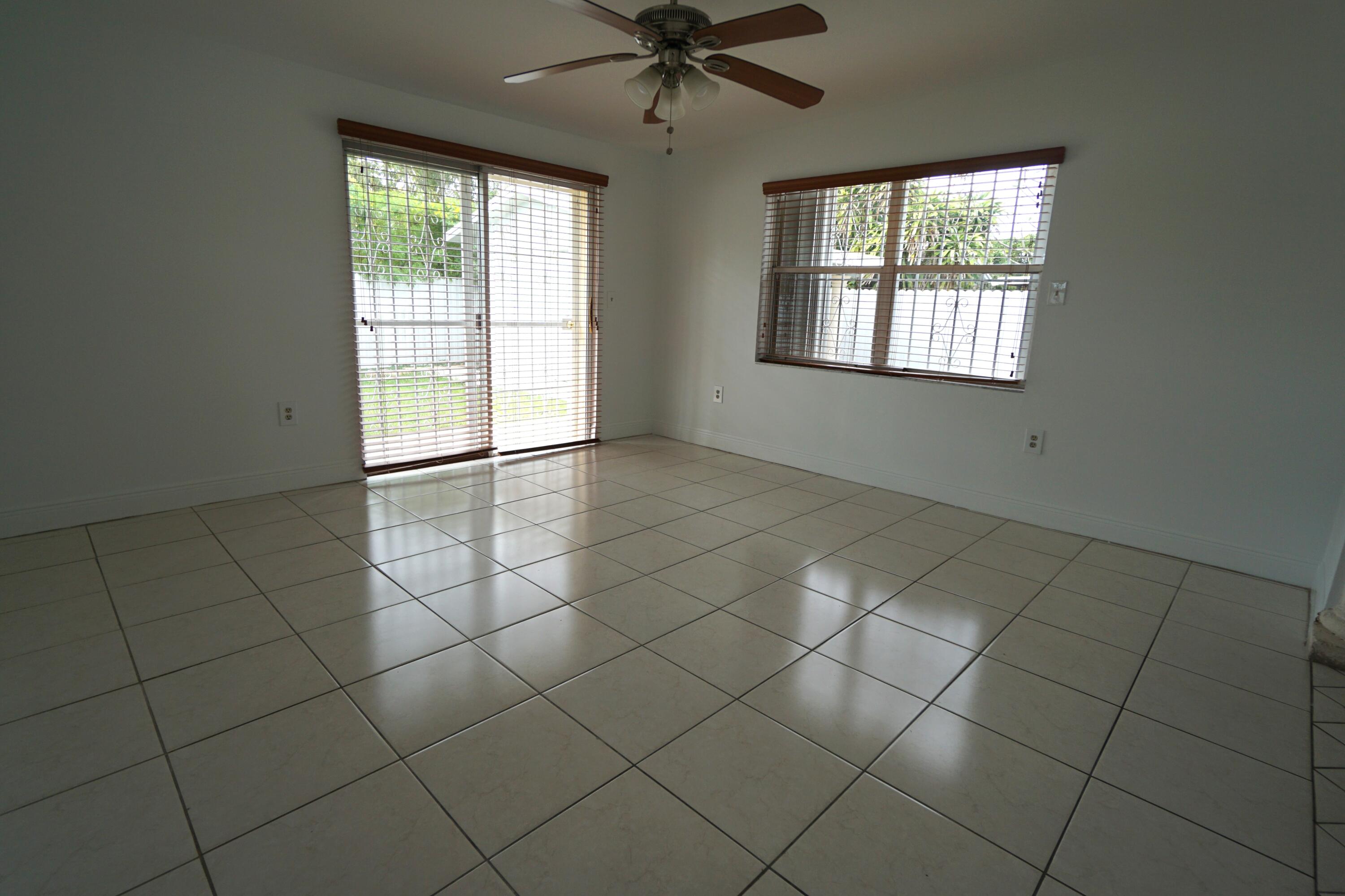 15520 Southwest 302nd Street Homestead, FL 33033 - Photo 5 of 20 a view of an empty room with a window