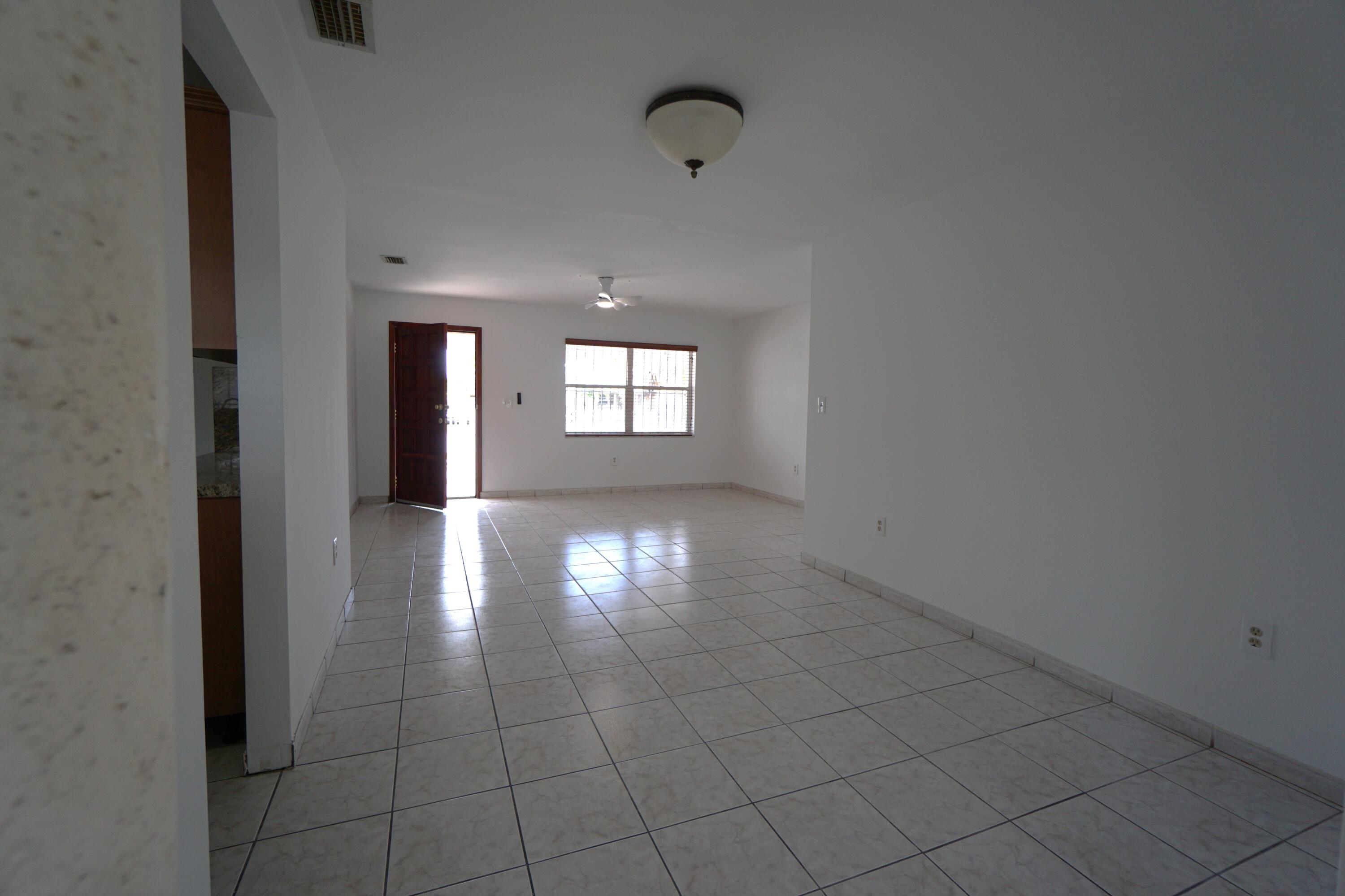 15520 Southwest 302nd Street Homestead, FL 33033 - Photo 6 of 20 a view of empty room with window