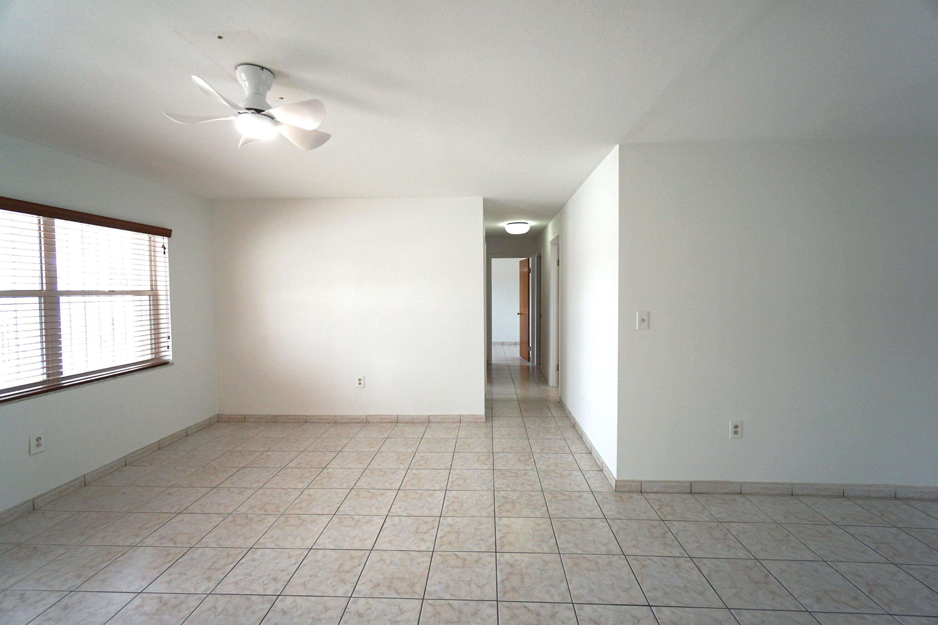 15520 Southwest 302nd Street Homestead, FL 33033 - Photo 7 of 20 an empty room with windows and closet