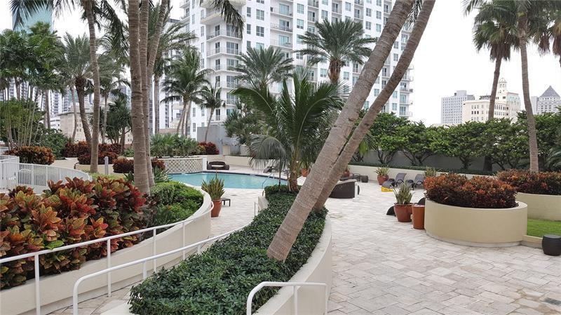 253 Northeast 2nd Street, Unit 421 Miami, FL 33132 - Photo 30 of 39 a view of a house with a yard and entertaining space