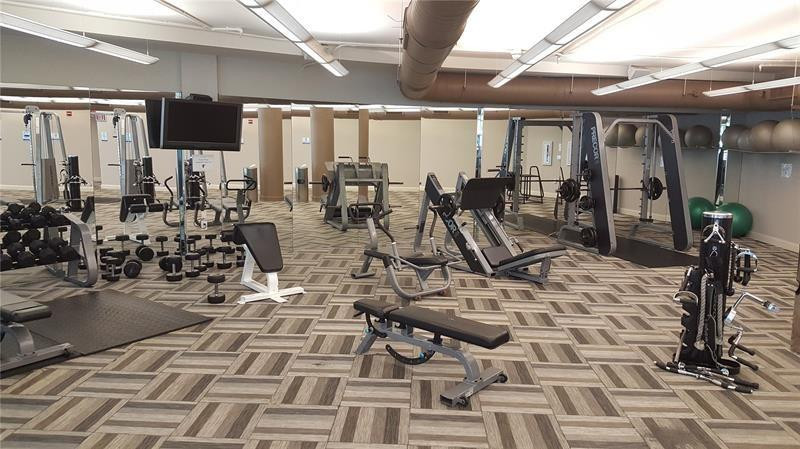 253 Northeast 2nd Street, Unit 421 Miami, FL 33132 - Photo 33 of 39 a view of a room with gym equipment