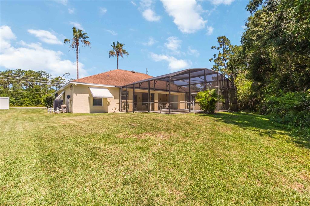 3225 Canoe Creek Road St. Cloud, FL 34772 - Photo 29 of 30 a front view of a house with a yard