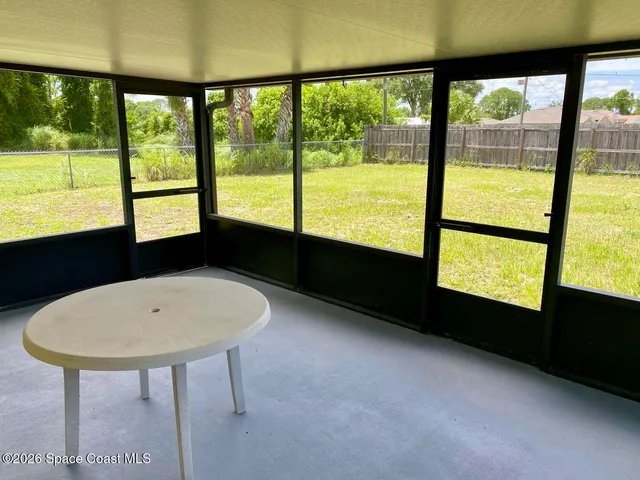 a living room with large windows