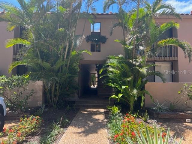 122 Pass Key Road, Unit 122 Sarasota, FL 34242 - Photo 1 of 1 a plant that is in front of flowers