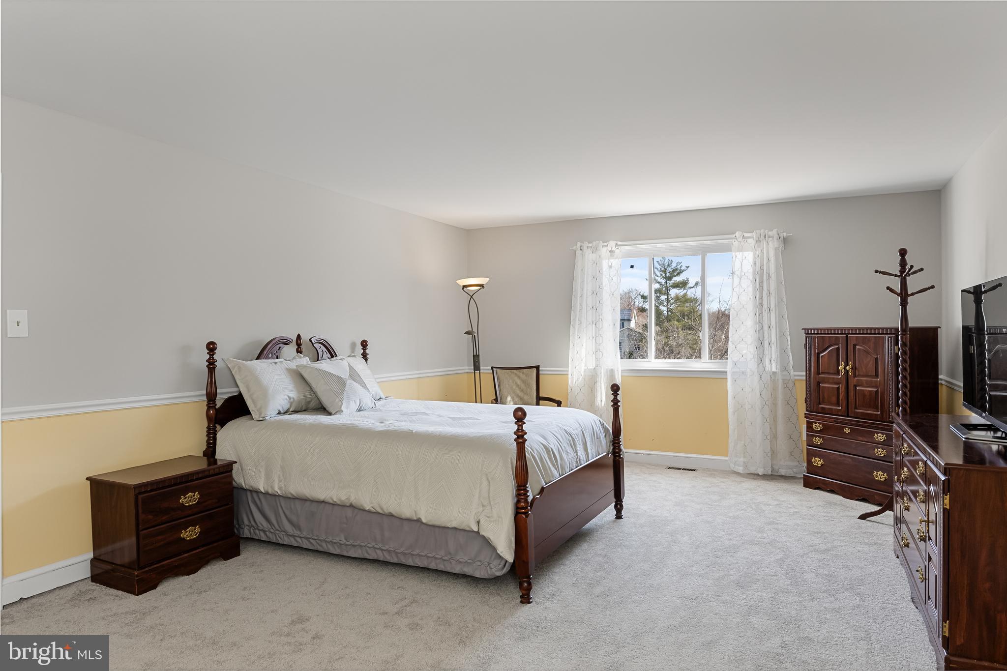 242 Sandringham Road Cherry Hill, NJ 08003 - Photo 21 of 36 a bedroom with a bed and a flat tv screen on dresser