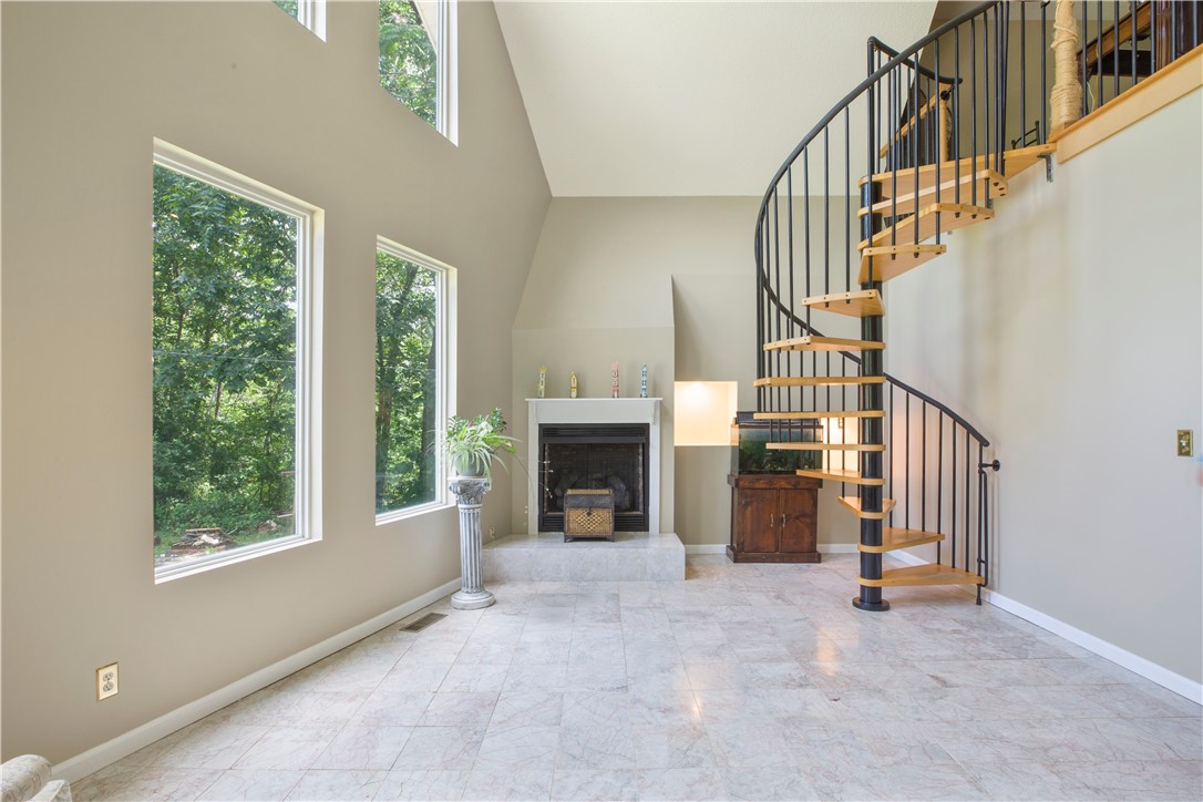 150 William Road Belton, SC 29627 - Photo 4 of 40 Winding staircase in the Den leading to the loft.
