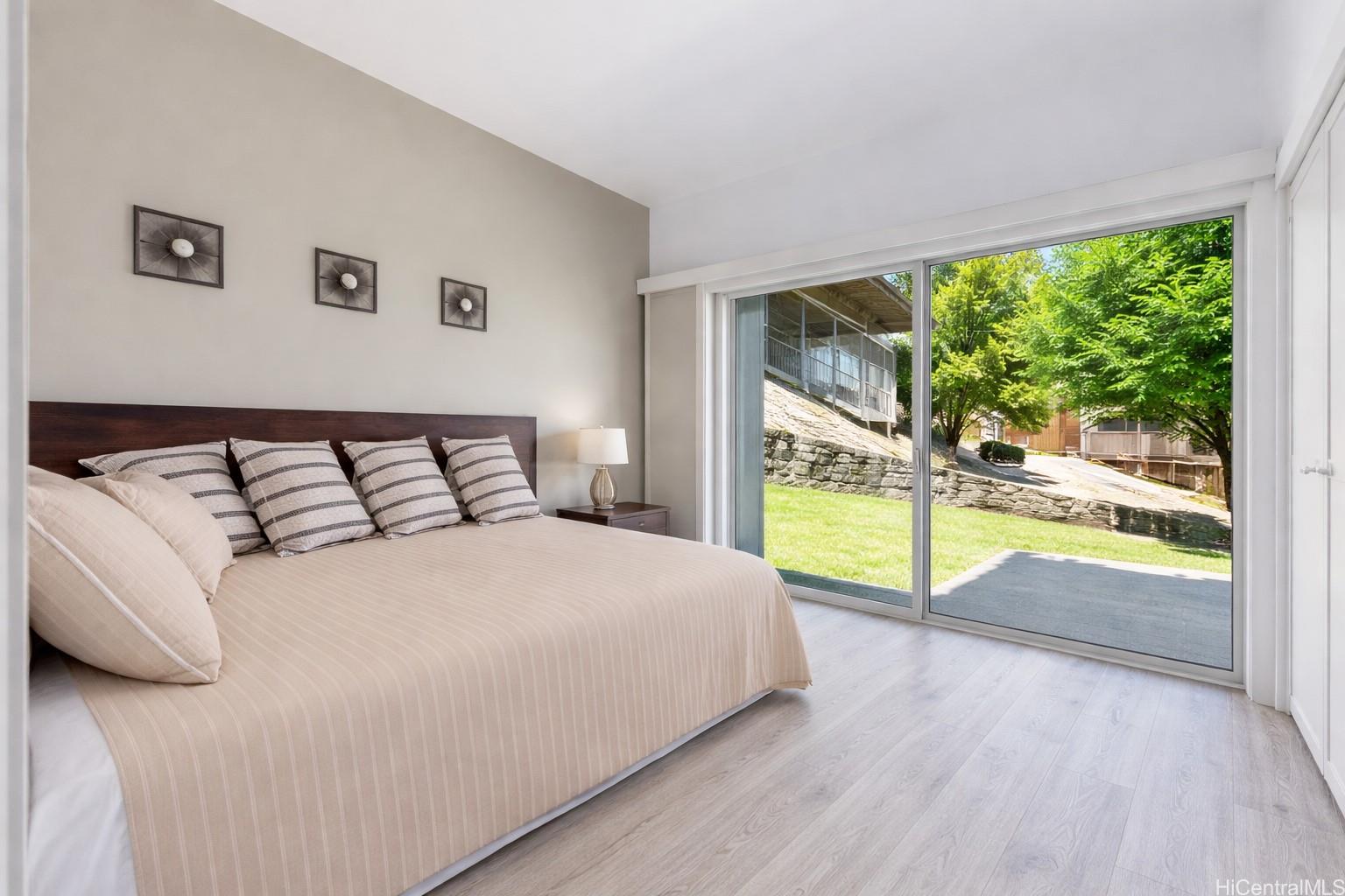 45-081 Lilipuna Road, Unit A Kaneohe, HI 96744 - Photo 14 of 21 Bedroom 2 with slider to small deck and large yard