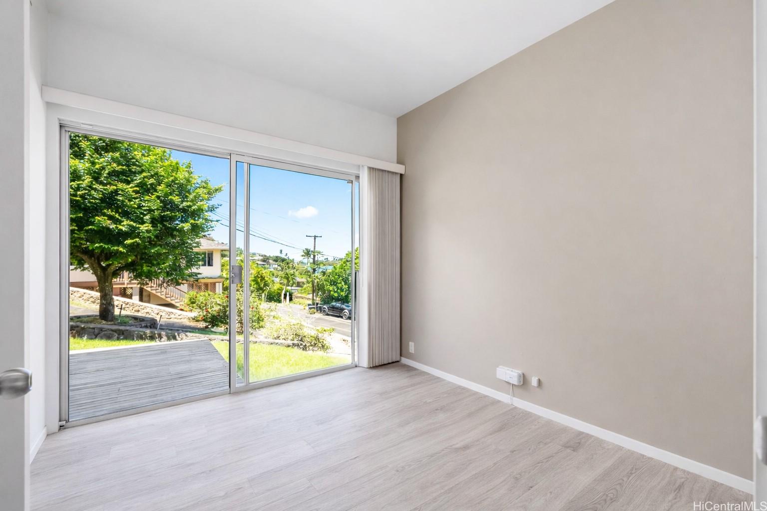 45-081 Lilipuna Road, Unit A Kaneohe, HI 96744 - Photo 15 of 21 Bedroom 3 with slider to small deck and large yard.