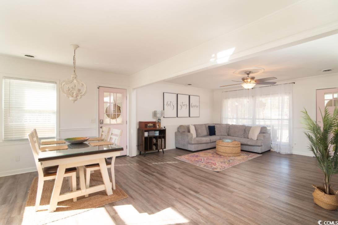 467 Harrelson Road Georgetown, SC 29440 - Photo 11 of 40 Living room featuring ceiling fan and dark wood-ty