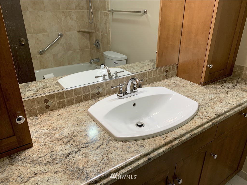 22406 31st Avenue Southeast Bothell, WA 98021 - Photo 14 of 32 a bathroom with a sink and a mirror