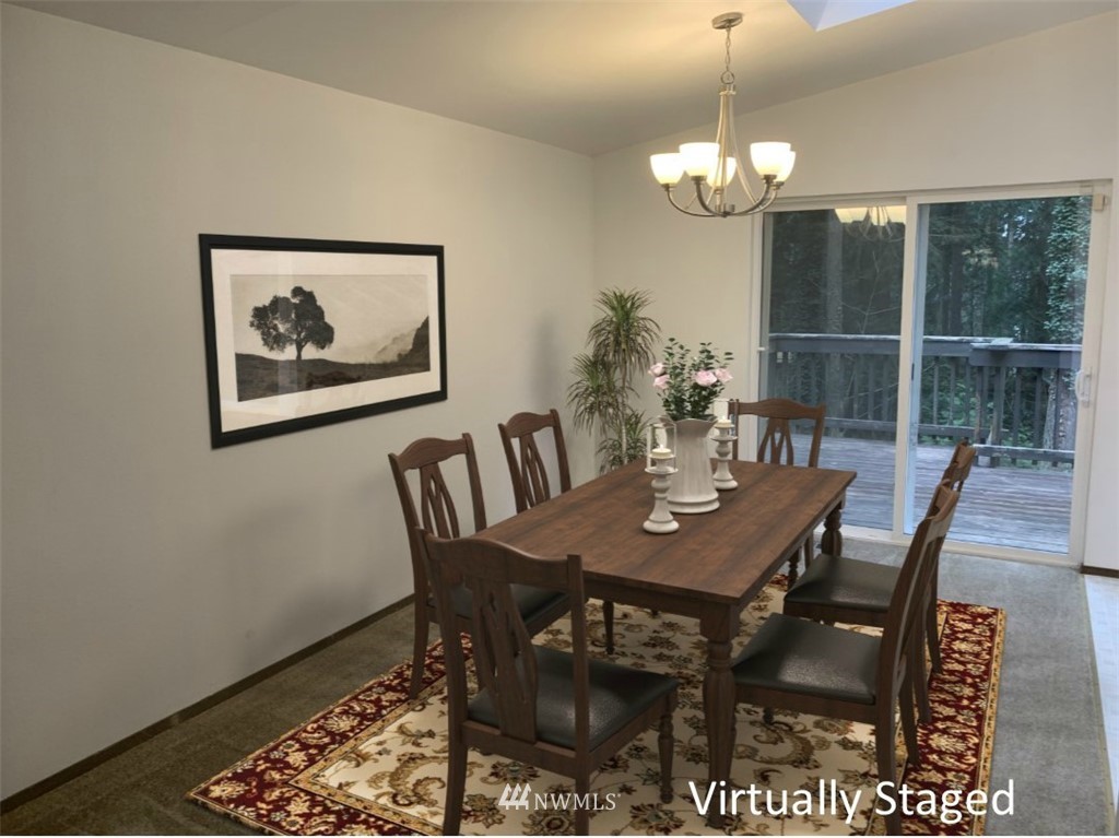 22406 31st Avenue Southeast Bothell, WA 98021 - Photo 3 of 32 a view of a dining room with furniture