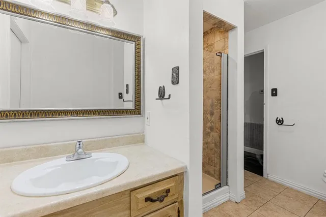 an aerial view of a houses with a yard