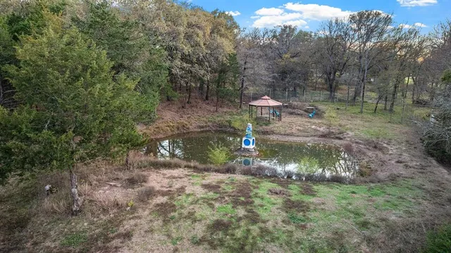 an aerial view of residential house with outdoor space