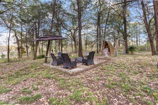 a view of outdoor space with lots of trees
