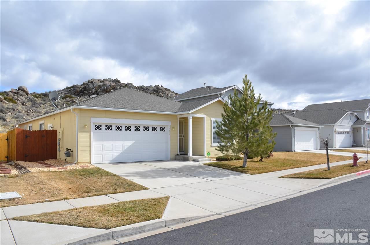 7614 Corso Street Reno, NV 89506 - Photo 1 of 1 a view of a house with a iron fence