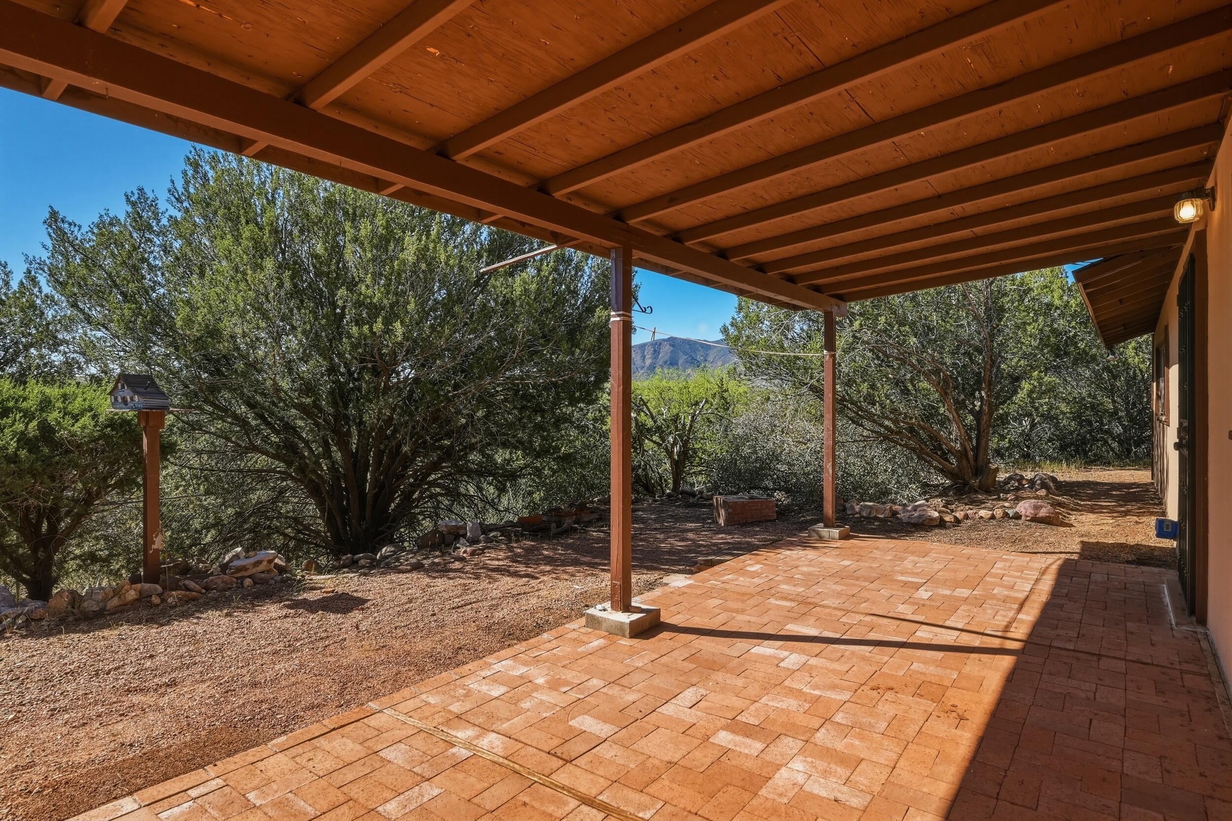 198 Lucky Lane Payson, AZ 85541 - Photo 20 of 31 a backyard of a house with table and chairs