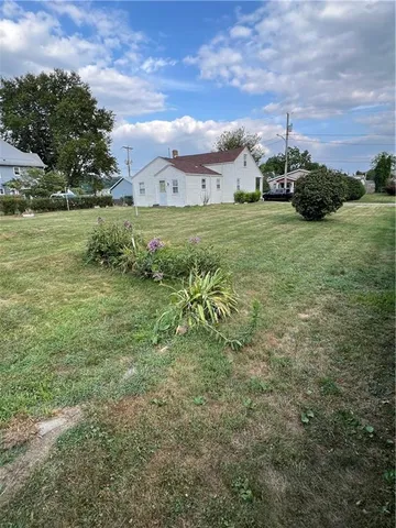 a view of a field with an trees