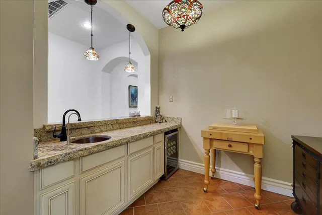 a bathroom with a sink a vanity and a mirror