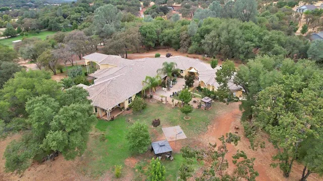 an aerial view of house with yard