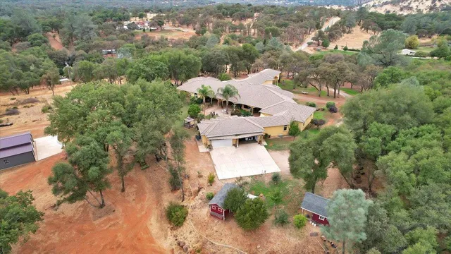an aerial view of house with yard